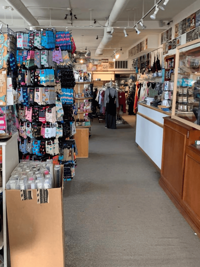 Colorful socks display in a cozy boutique clothing store.