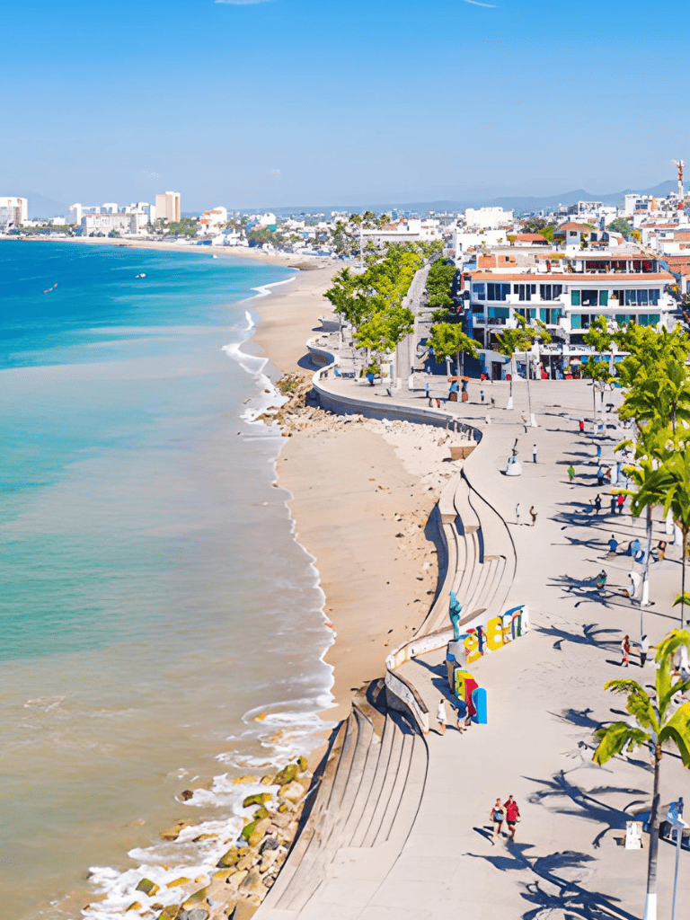 Vibrant coastal cityscape with beach, promenade, and modern buildings on sunny day.