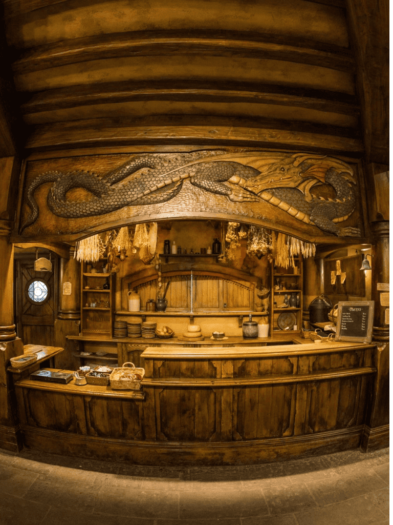 Rustic wooden bar with dragon carving decor and cozy warm ambiance, ideal for a unique dining experience.