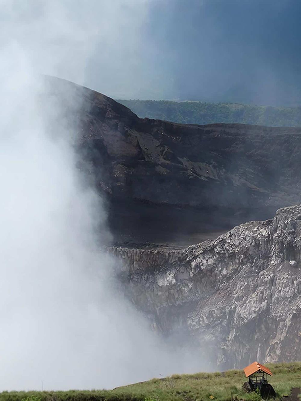 Steam eruption at Mount Bromo volcanic crater, Indonesia, showcasing geothermal activity and stunning natural scenery.