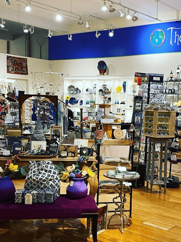 Colorful boutique shop displaying decorative items, jewelry, and souvenirs with a vibrant, inviting atmosphere.