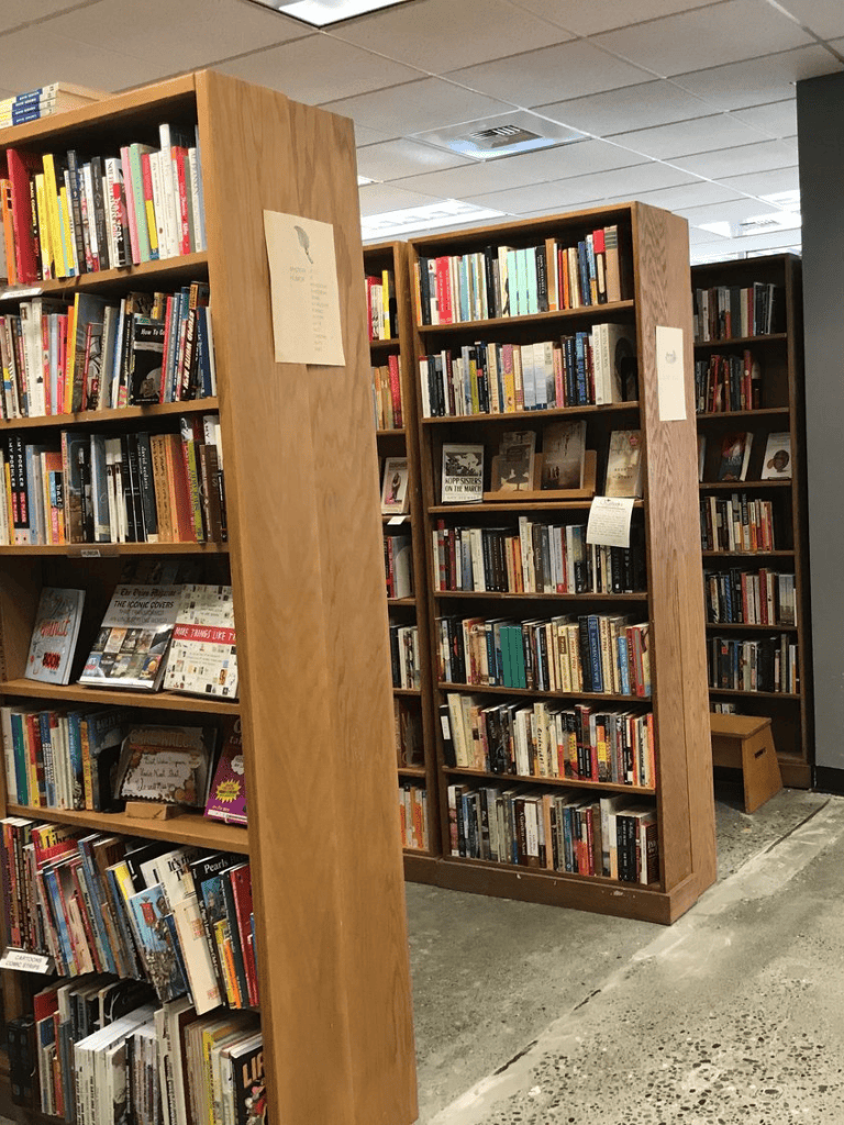 Vintage bookstore shelves filled with a wide selection of books and magazines.