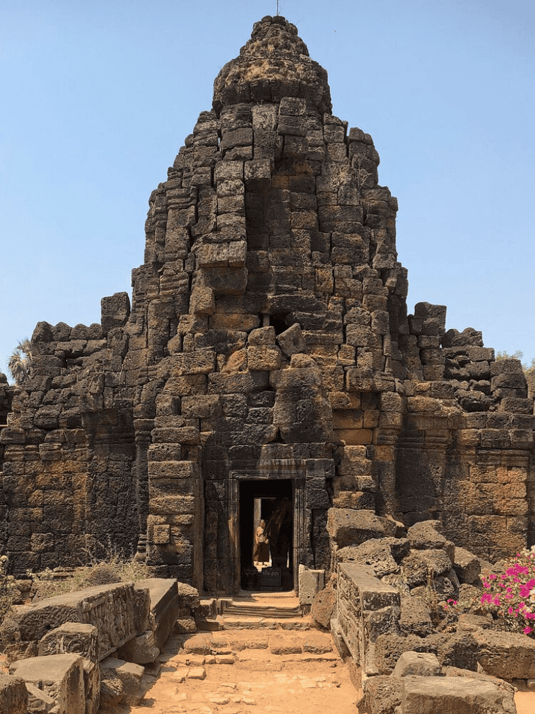 Ancient stone temple at Angkor Wat, Cambodia, historical cultural site for tourism and exploration.