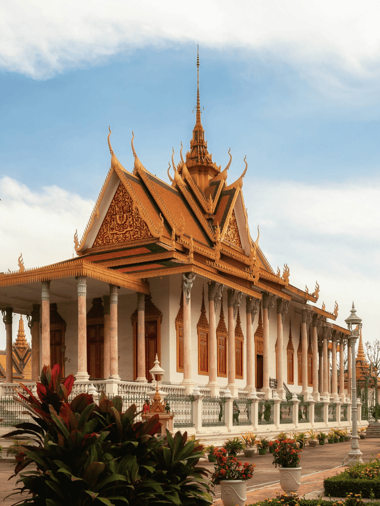 Intricate Thai temple architecture with golden roof and ornate details, popular tourist destination.