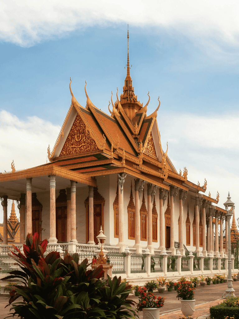 Intricate traditional Thai temple with ornate golden roof and decorative architecture.