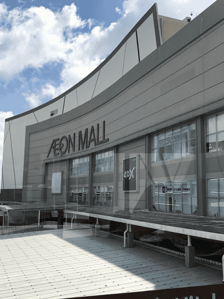 Modern AEON MALL storefront showcasing contemporary architecture and shopping experience in the city.