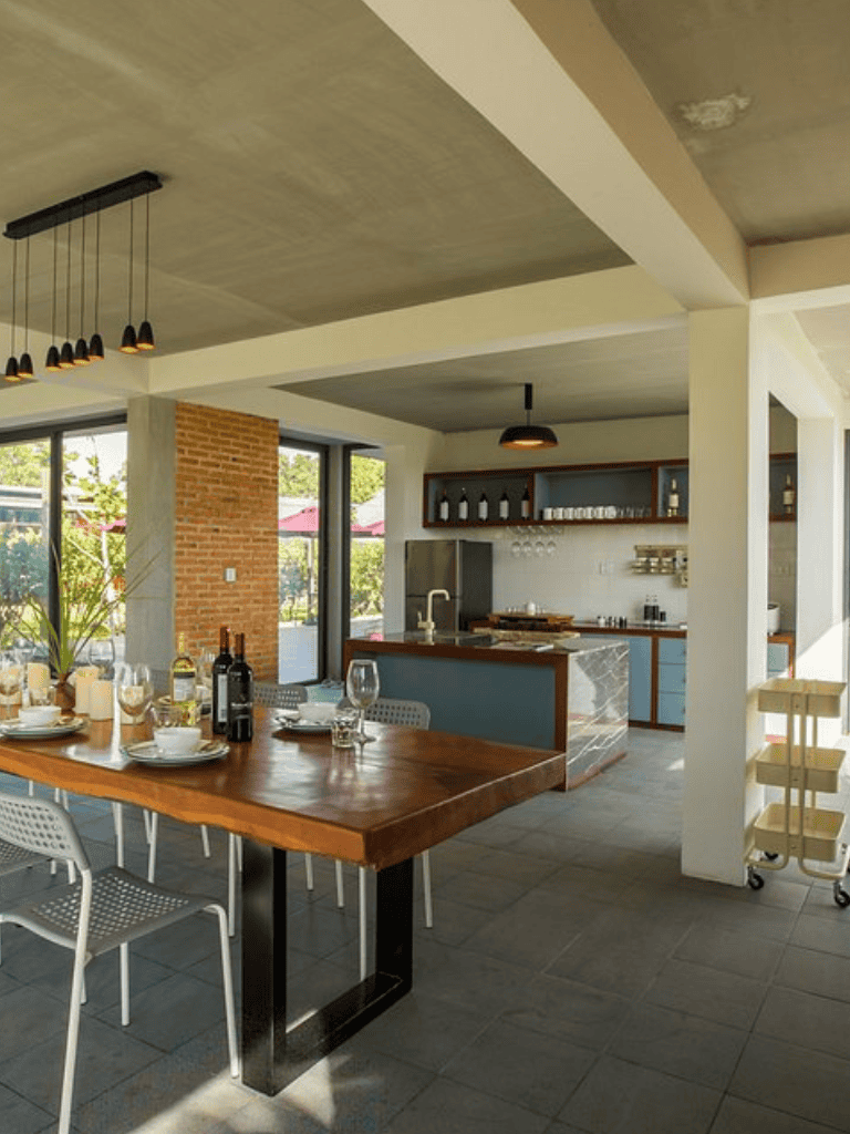 Modern open-concept kitchen and dining area with natural light and contemporary decor.