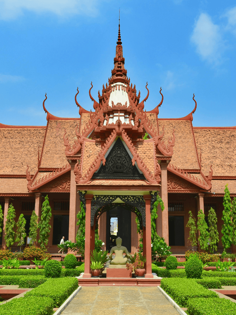 Magnificent Thai Buddhist temple with intricate architecture and lush surrounding garden.