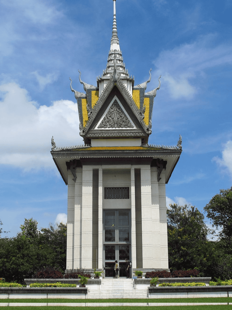 Colorful Thai temple with intricate architecture and a blue sky background.