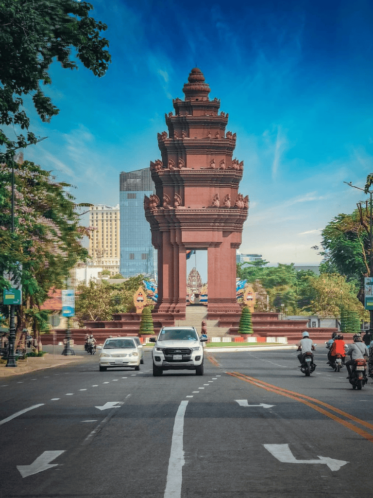 Ancient monument in city center, Vietnam, popular tourist attraction, modern skyline behind.