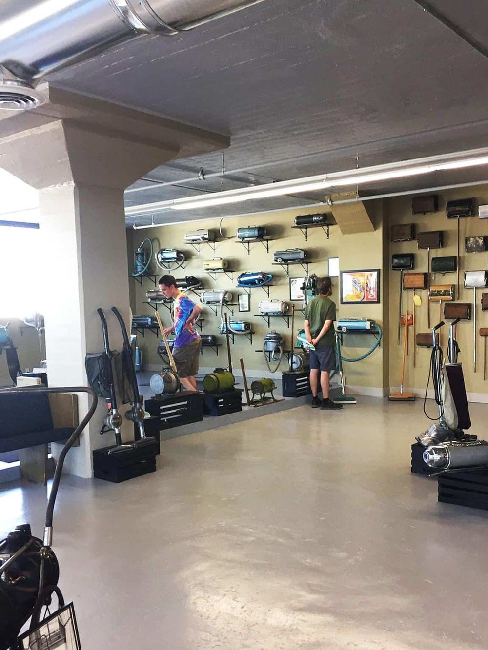 Industrial vacuum cleaner display at QuestForDirections store – wide selection of commercial cleaning equipment.