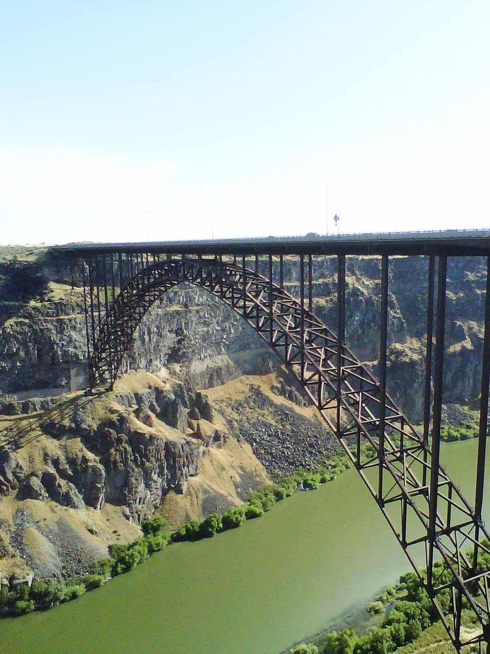 Majestic steel arch bridge spanning the Columbia River at the Grand Coulee Dam in Washington.