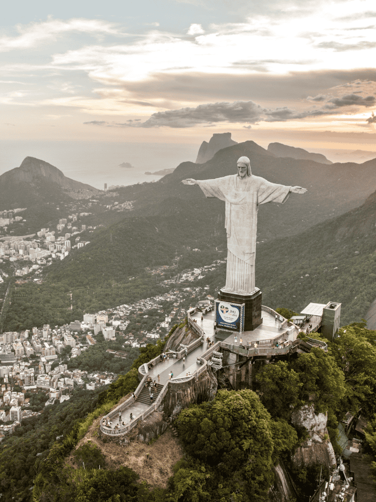 Majestic Christ the Redeemer statue in Rio de Janeiro, Brazil, at sunset, popular travel destination and iconic landmark.