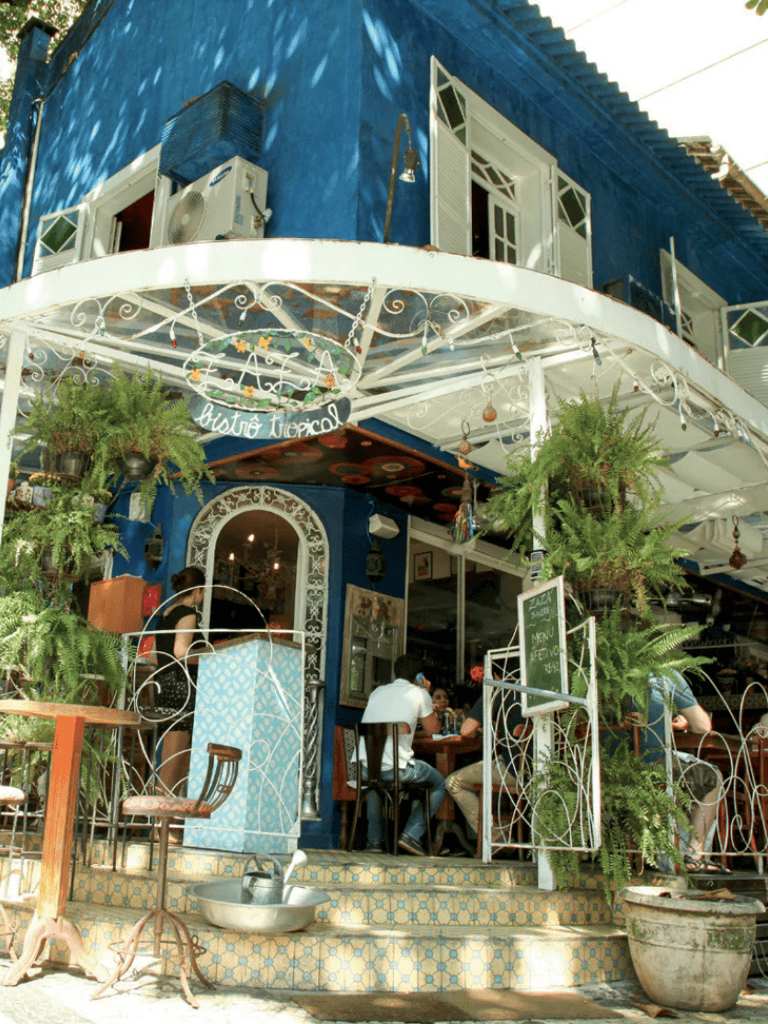 Colorful Caribbean-style restaurant with outdoor seating and tropical decor.