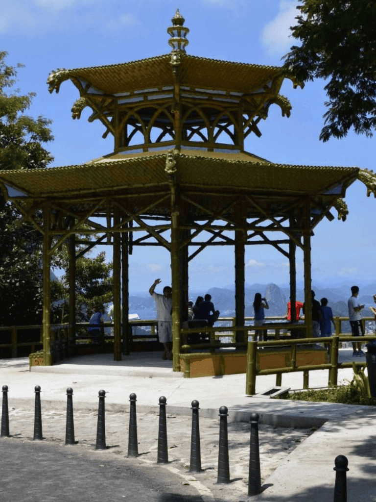 Traditional Asian pagoda with tourists enjoying scenic views, perfect for sightseeing and cultural exploration.