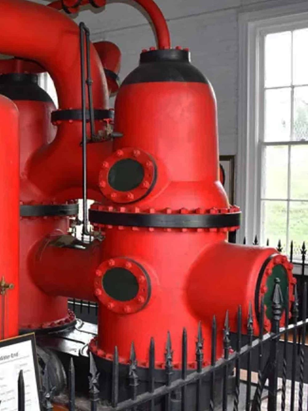 Heavy-duty fire pump system in bright red, used for emergency fire protection and safety.