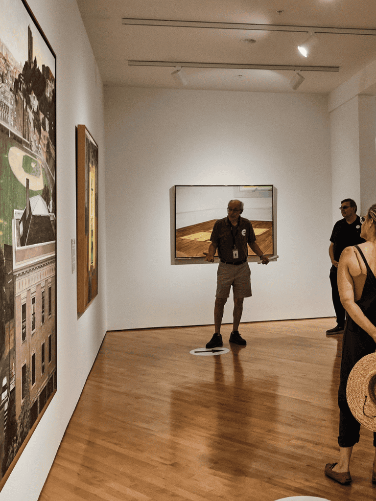 Art gallery visitors observing contemporary artwork at QuestForDirections.