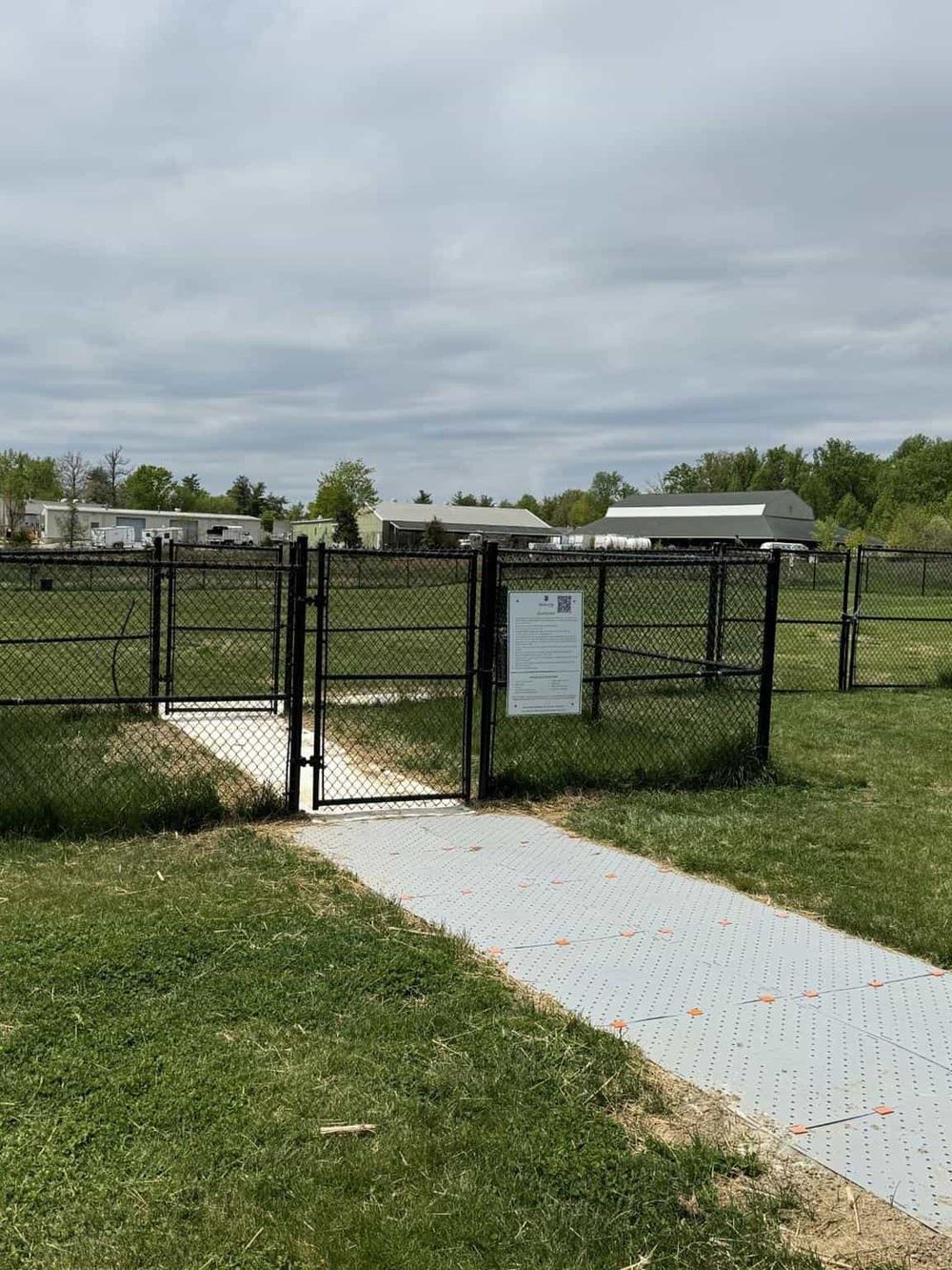 Secure outdoor fencing and gates at QuestForDirections facility for safe navigation.