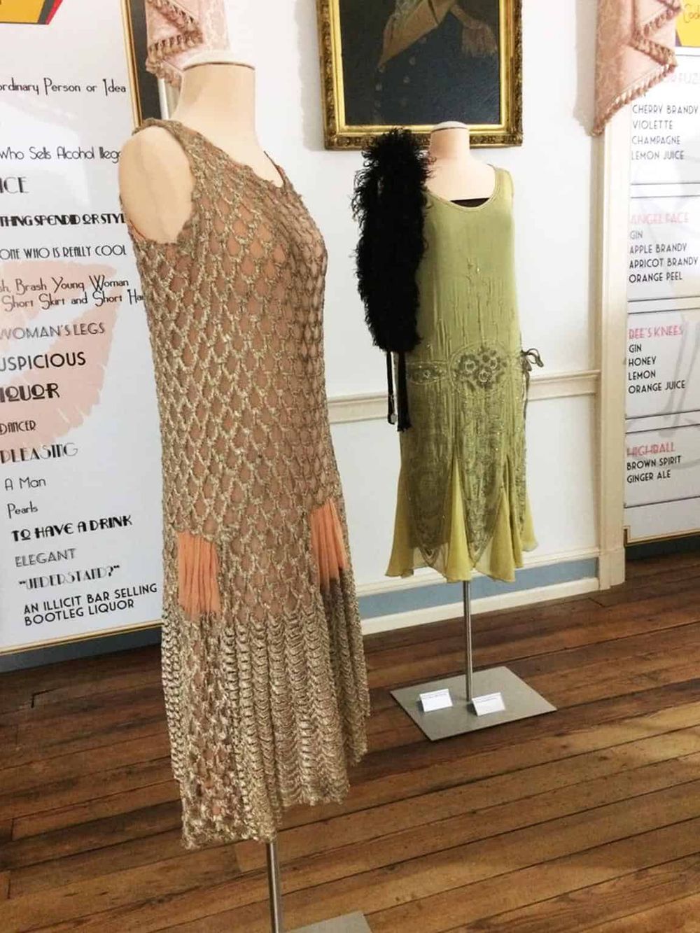 Intriguing vintage dresses displayed on mannequins at an art exhibit or boutique. Elegant, unique fashion pieces showcased in an aesthetically pleasing setting.