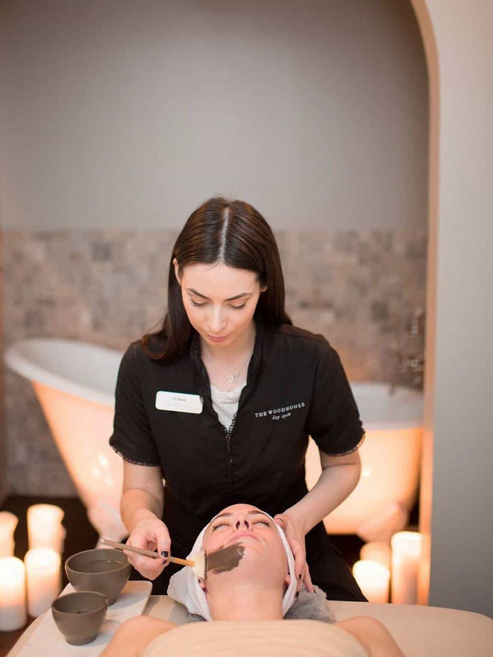 Relaxing spa facial treatment with professional esthetician at luxury wellness center.