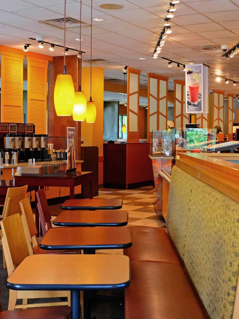 Bright casual dining area with warm lighting and cozy seating at QuestForDirections restaurant.