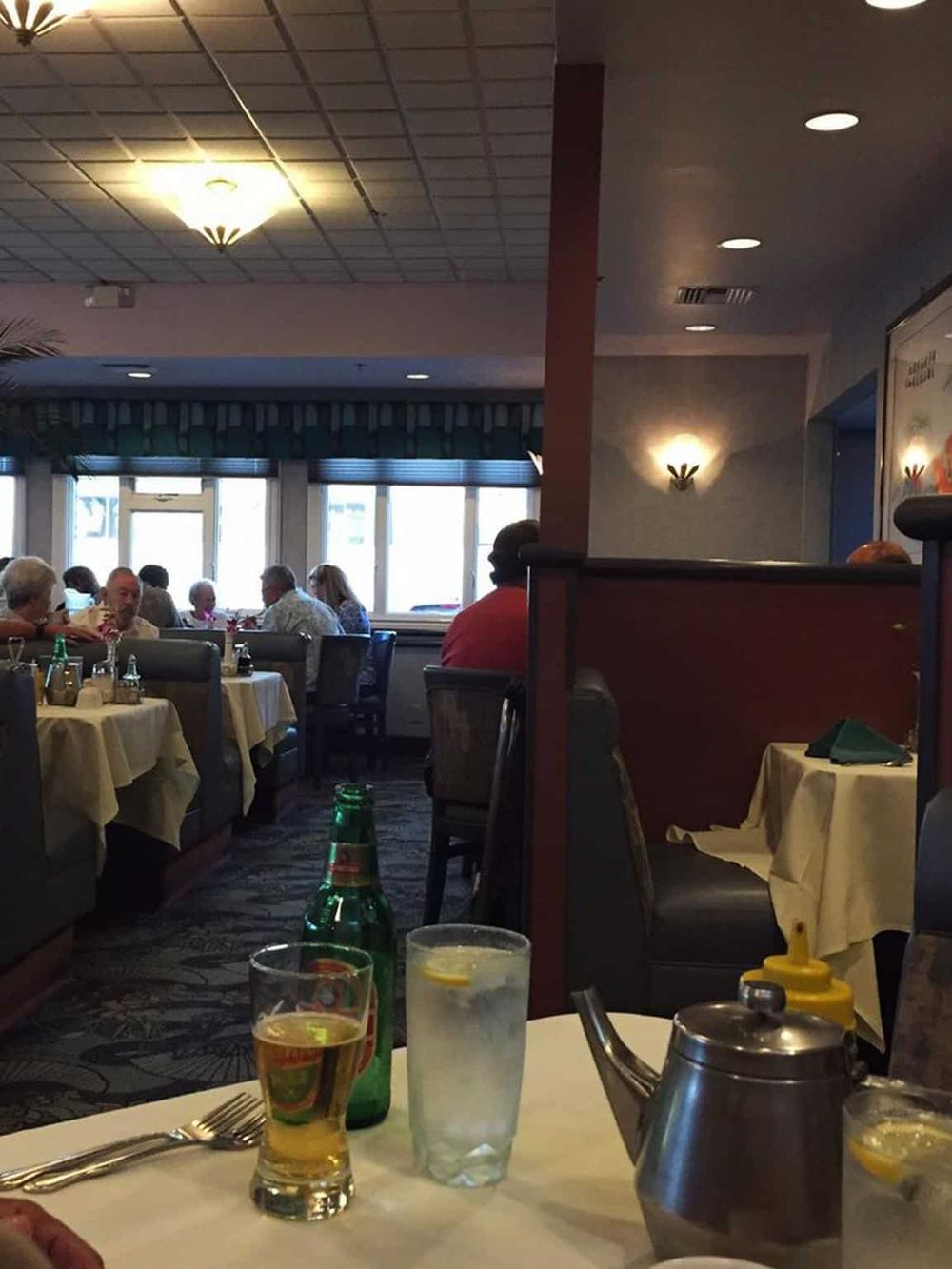 1. Cozy restaurant interior with diners enjoying meals and drinks.