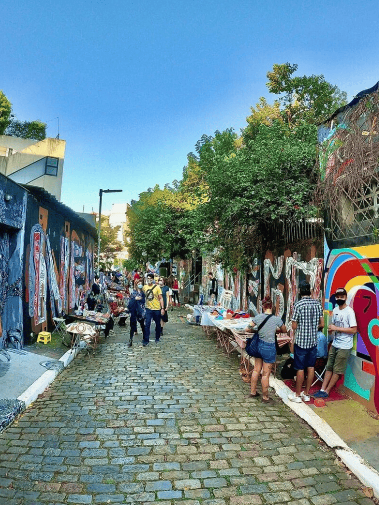 Colorful street art market in Mexico City's vibrant arts district, showcasing local artists and unique handcrafted goods.