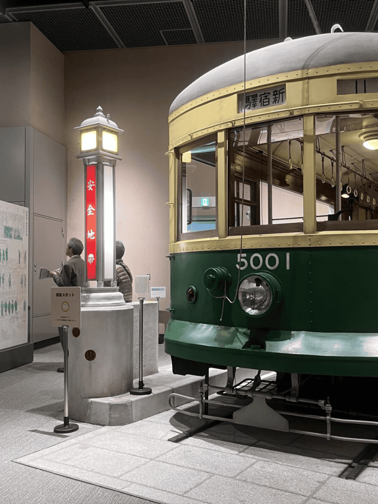 Historic streetcar exhibit in a transportation museum, showcasing vintage vehicle design and regional transit history.