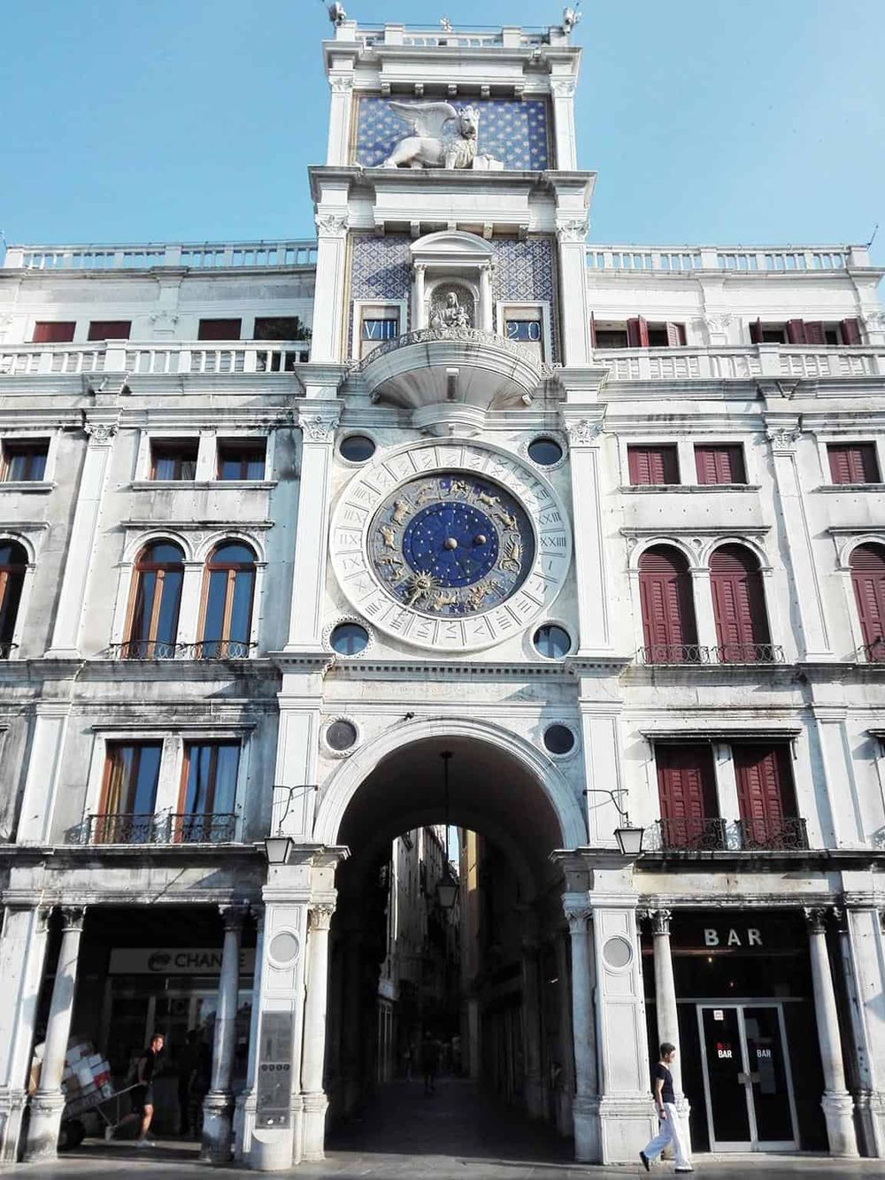 Intricate historic building with clock tower, focusing on city architecture and landmark sightseeing.