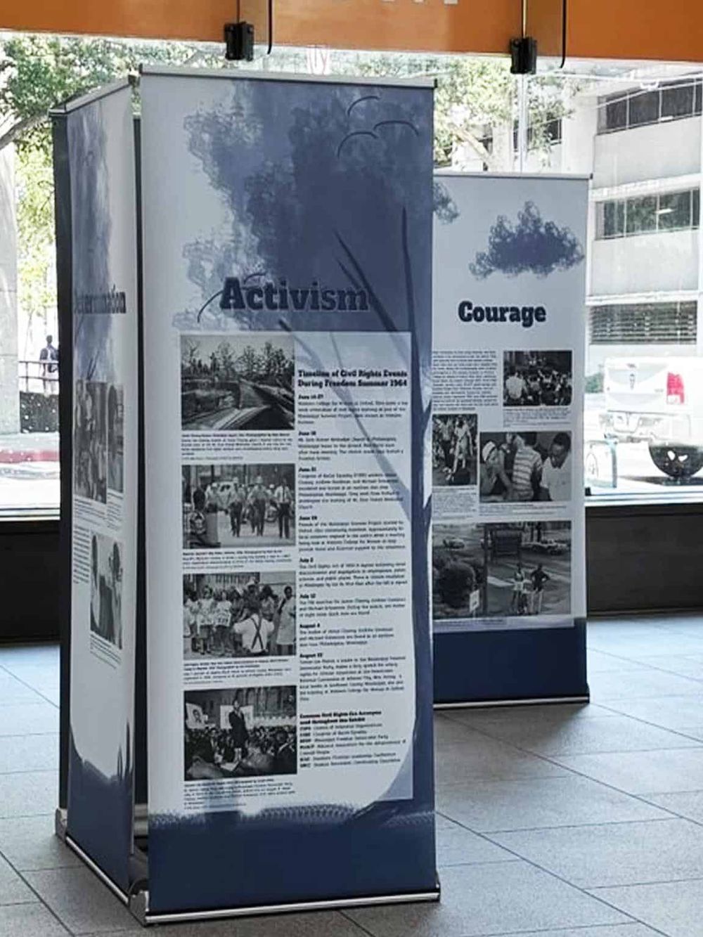 Historic activism and courage exhibit display boards at QuestForDirections event.