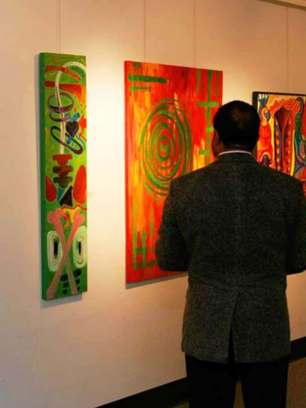 Colorful abstract art exhibition at QuestForDirections gallery in vibrant modern setting.