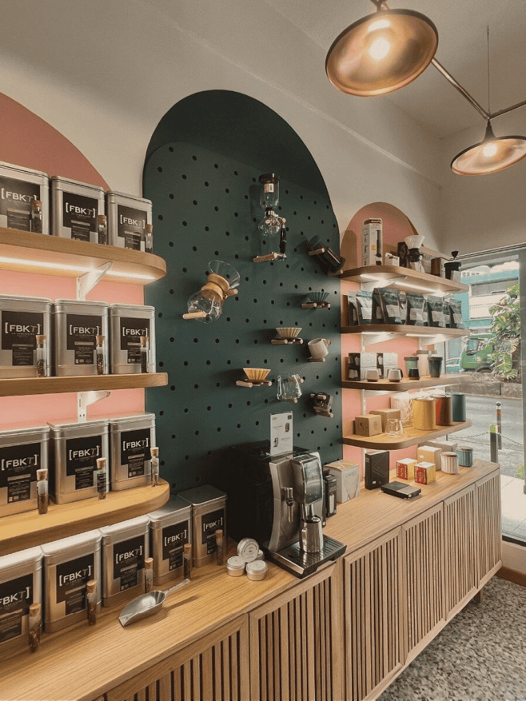 Creamy coffee brewing station with various coffee beans and accessories.