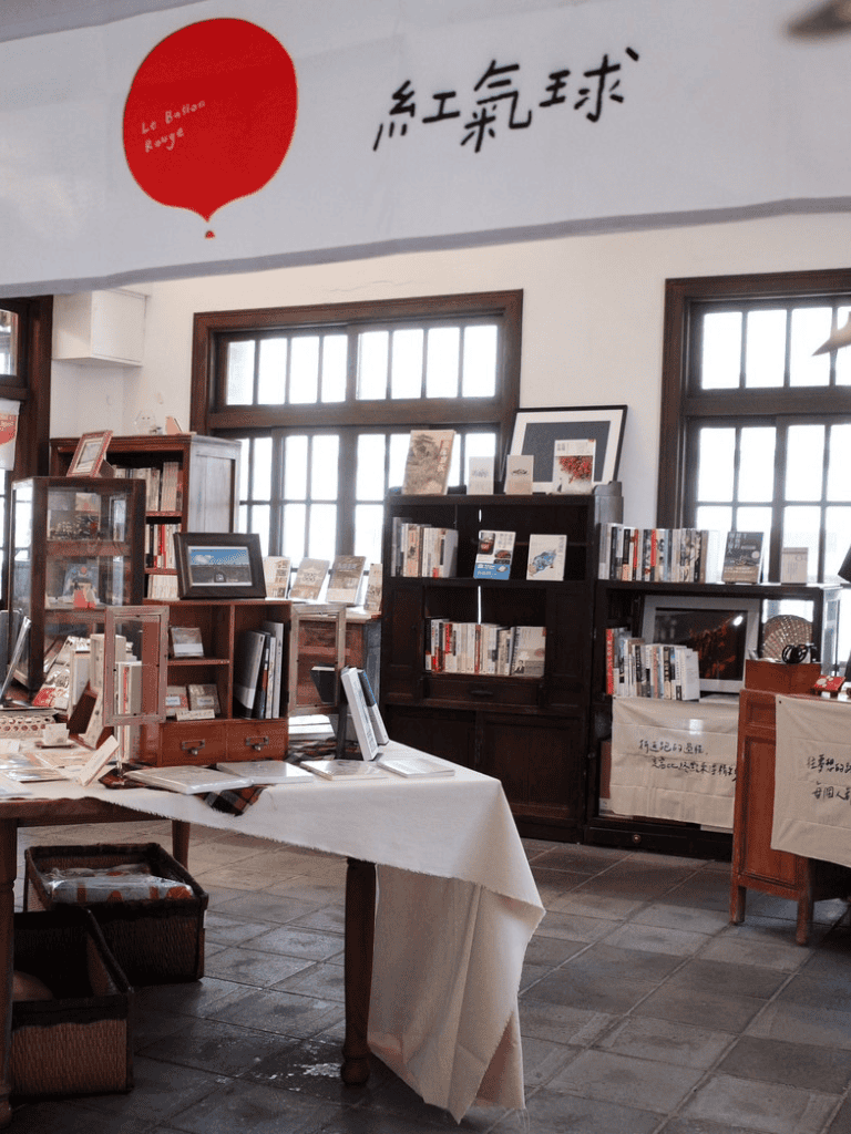 Old bookstore interior with bookshelves and cozy reading space, promoting literary exploration and community engagement.