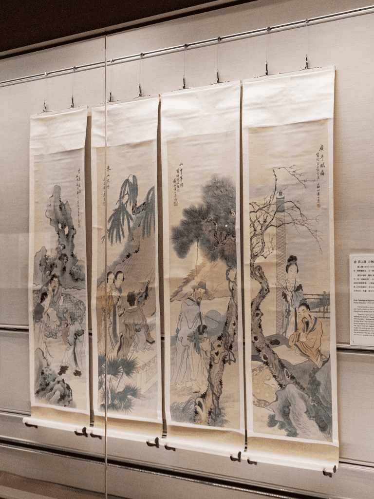 Traditional Chinese landscape painting scroll on display, showcasing artistic ink wash art and cultural heritage.
