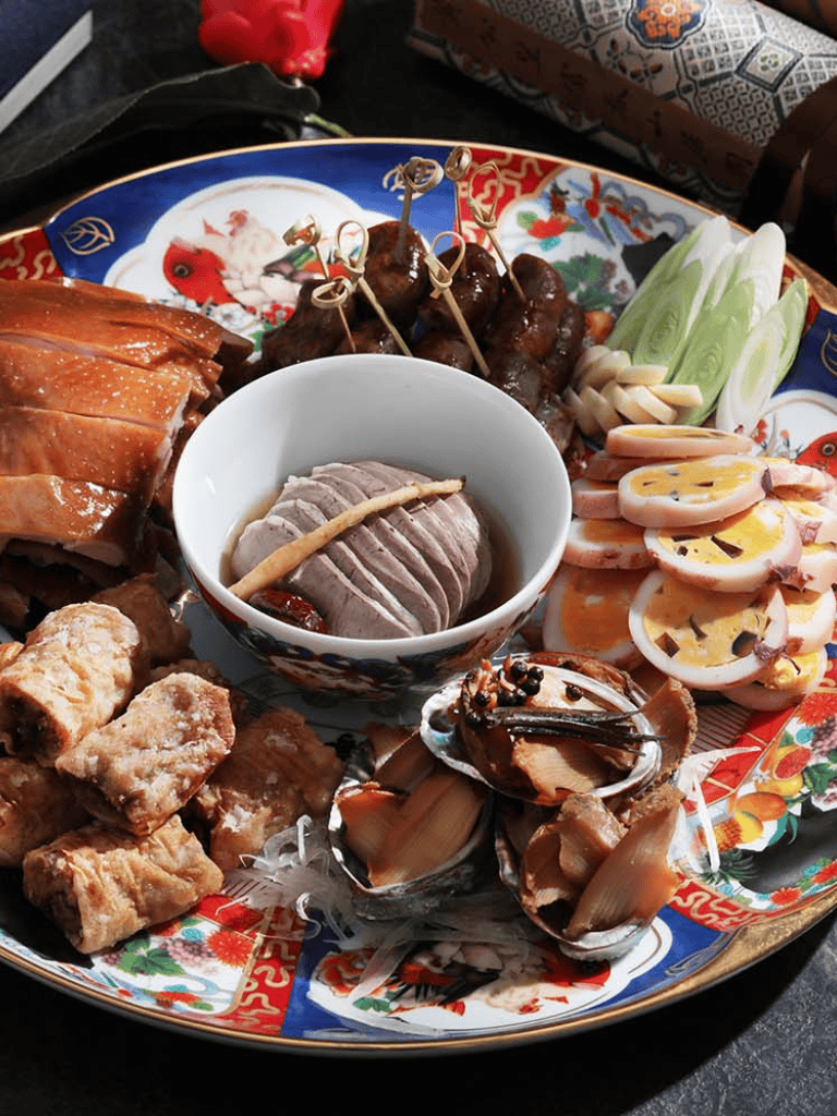 Fresh Asian appetizer platter with meat, seafood, and vegetables, perfect for sharing.