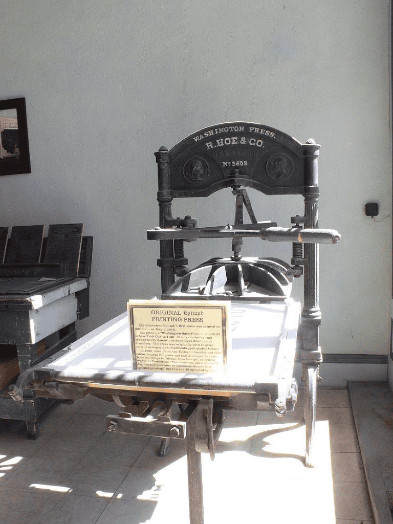 Antique printing press on display at Quest for Directions museum.