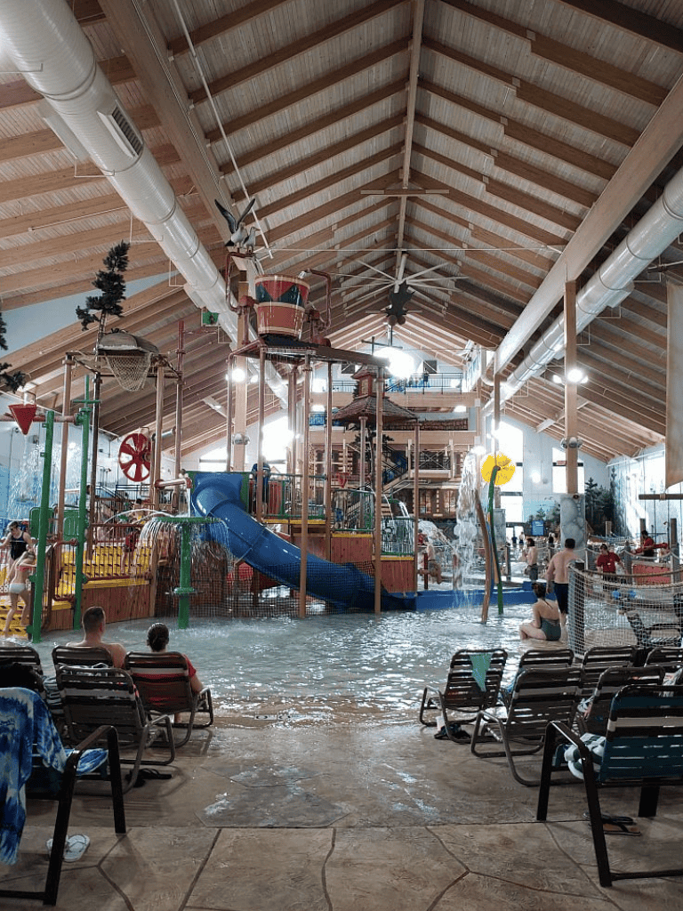 Indoor water park with slides and play area, family fun at QuestForDirections.