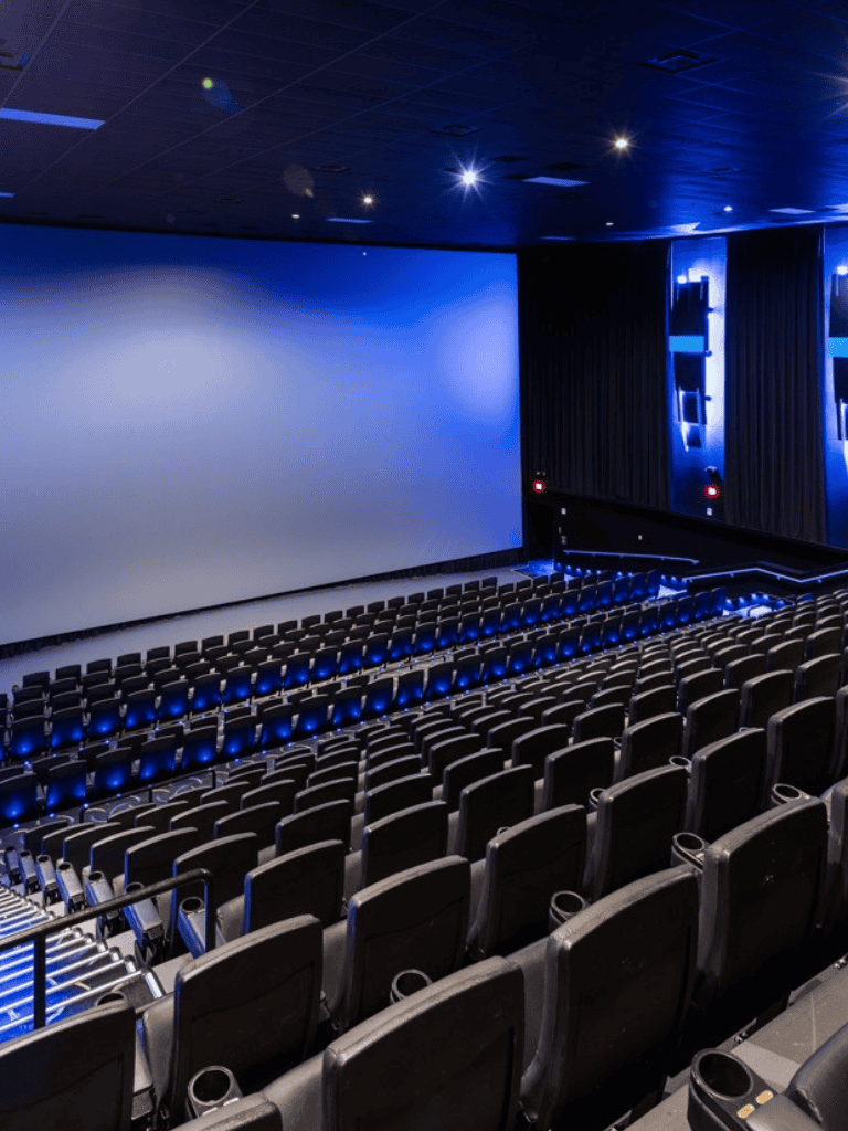 1. Modern movie theater with large screen and comfortable seats.