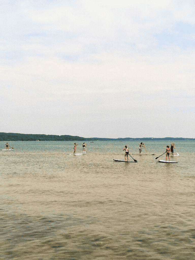 Enjoying stand-up paddleboarding on the calm waters at QuestForDirections coastal location.