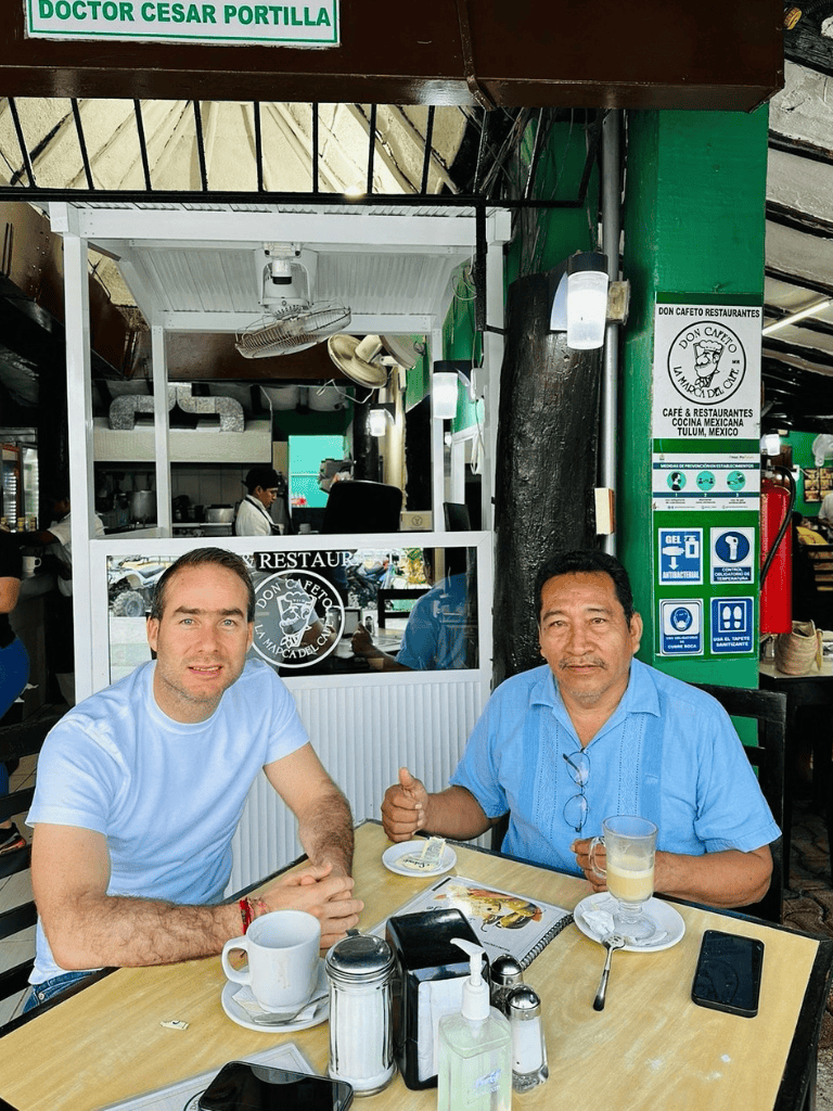 Enjoying Mexican cuisine at Don Cafeto restaurant in Tulum, Mexico, overlooking vibrant decor and friendly atmosphere.