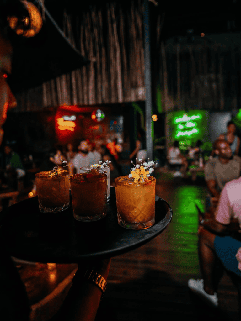 Elegant cocktails served in a lively nightlife setting at QuestForDirections.