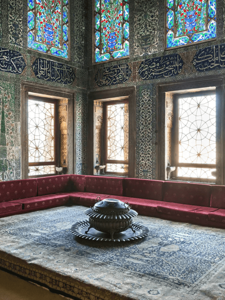 1. Intricate Islamic interior with stained glass windows and traditional patterns.
