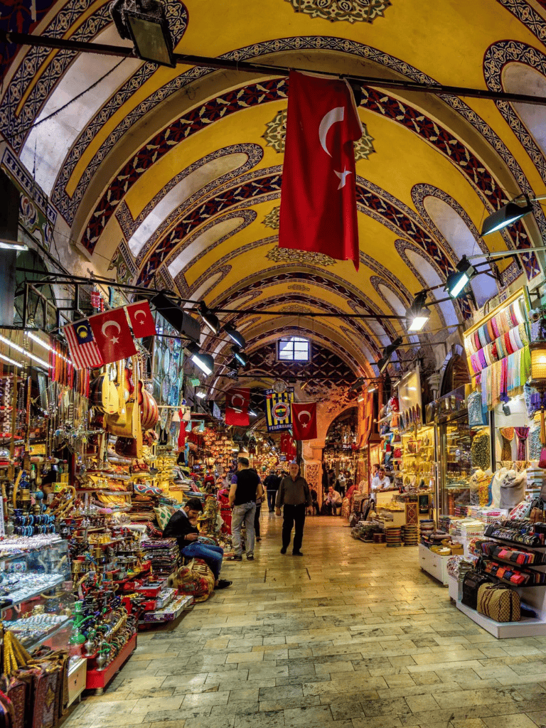 Colorful Turkish market with traditional souvenirs, flags, and vibrant textiles.
