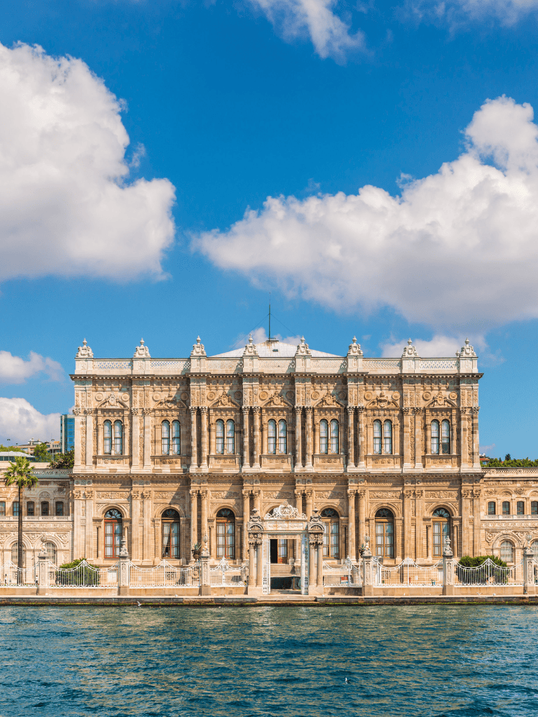 Luxurious historic waterfront building with ornate architecture and scenic water views.