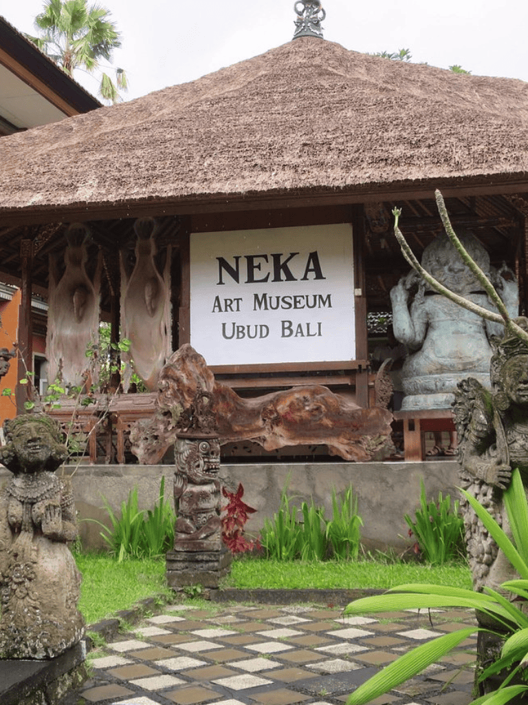 Colorful Bali art museum with traditional statues and lush greenery in Ubud, Bali.
