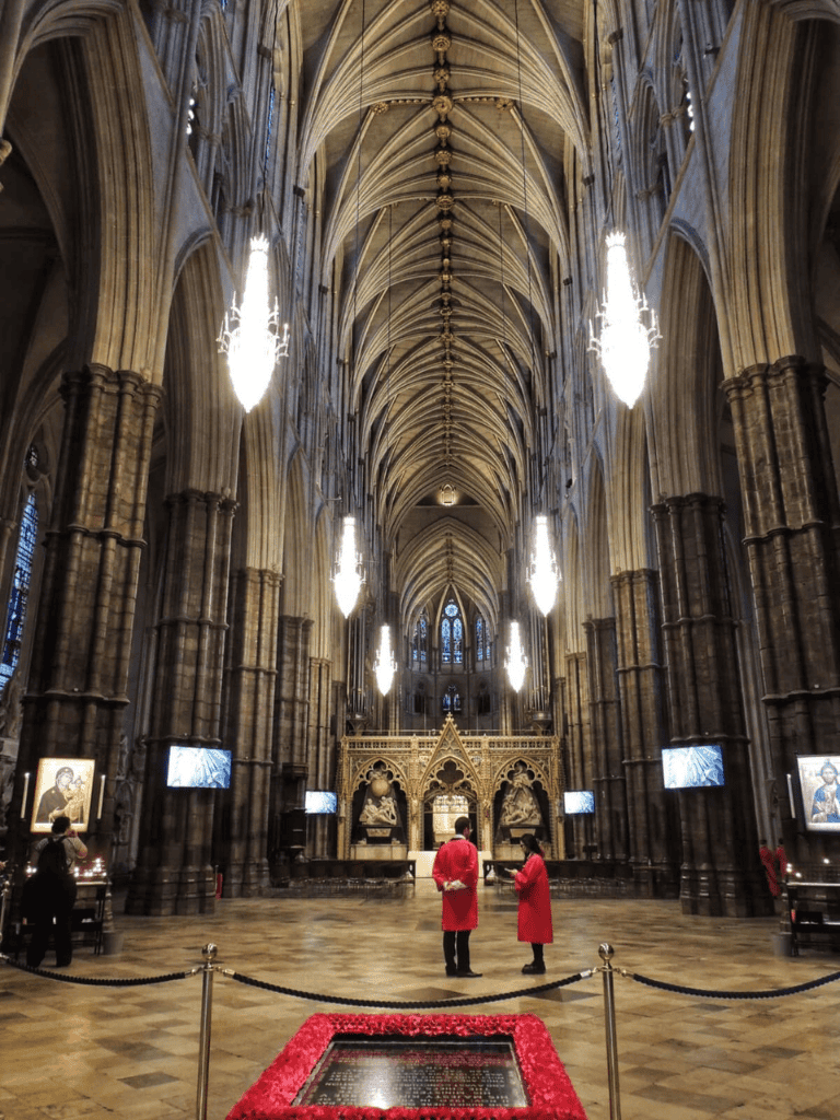 Stunning Gothic cathedral interior with high vaulted ceilings and elegant chandeliers.