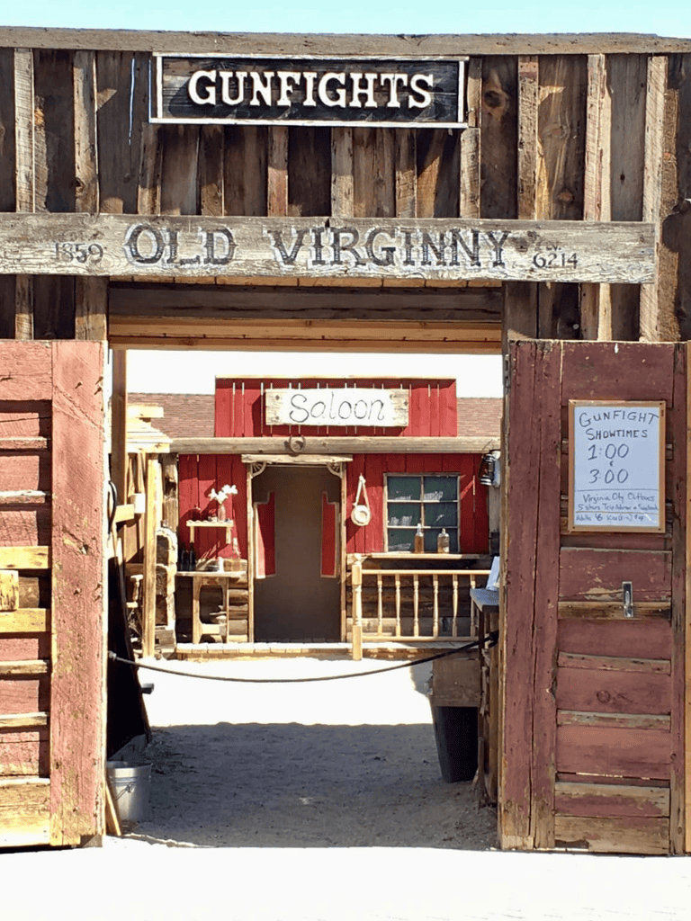 Old Virginia gunfight saloon entrance with rustic wood decor and signage.