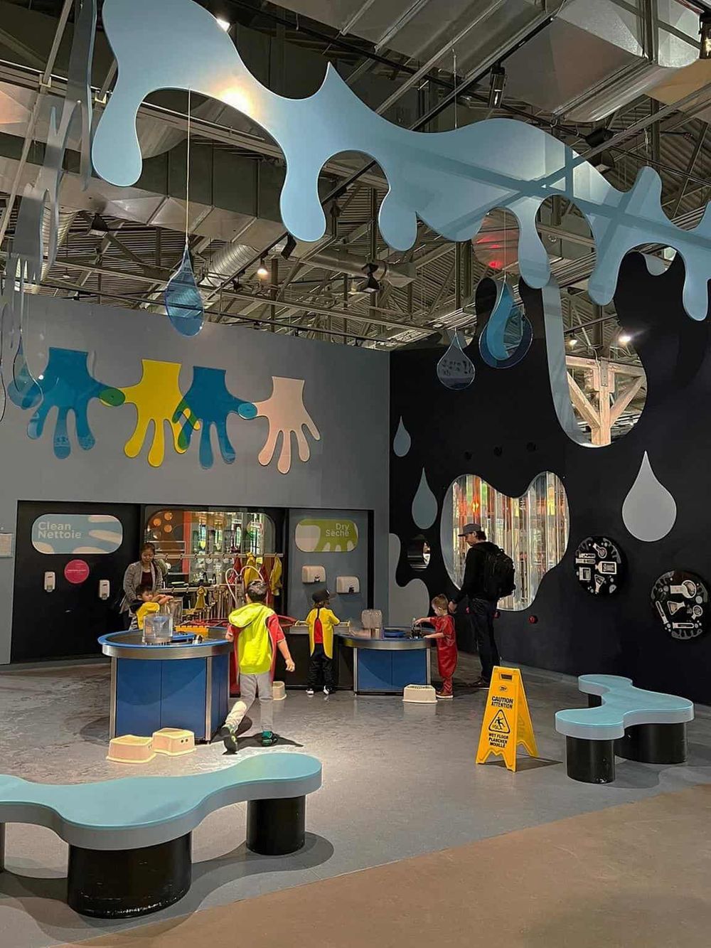 Colorful kids' educational play area at QuestForDirections with interactive water and hygiene learning stations.