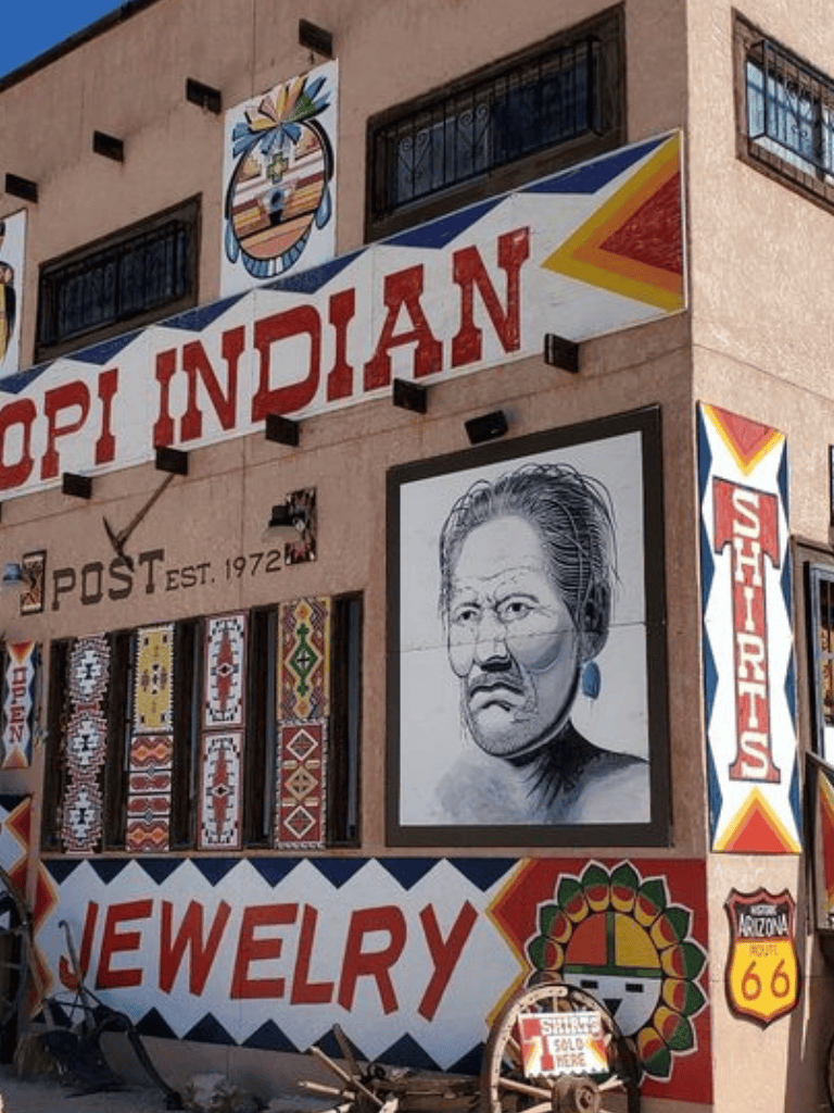 Traditional Native American jewelry and artwork showcased on building exterior for Indian jewelry shop.