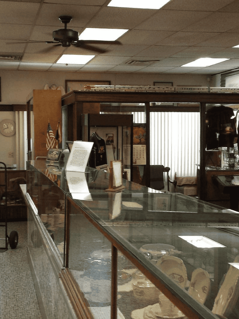 Antique shop display case with vintage memorabilia and collectibles.